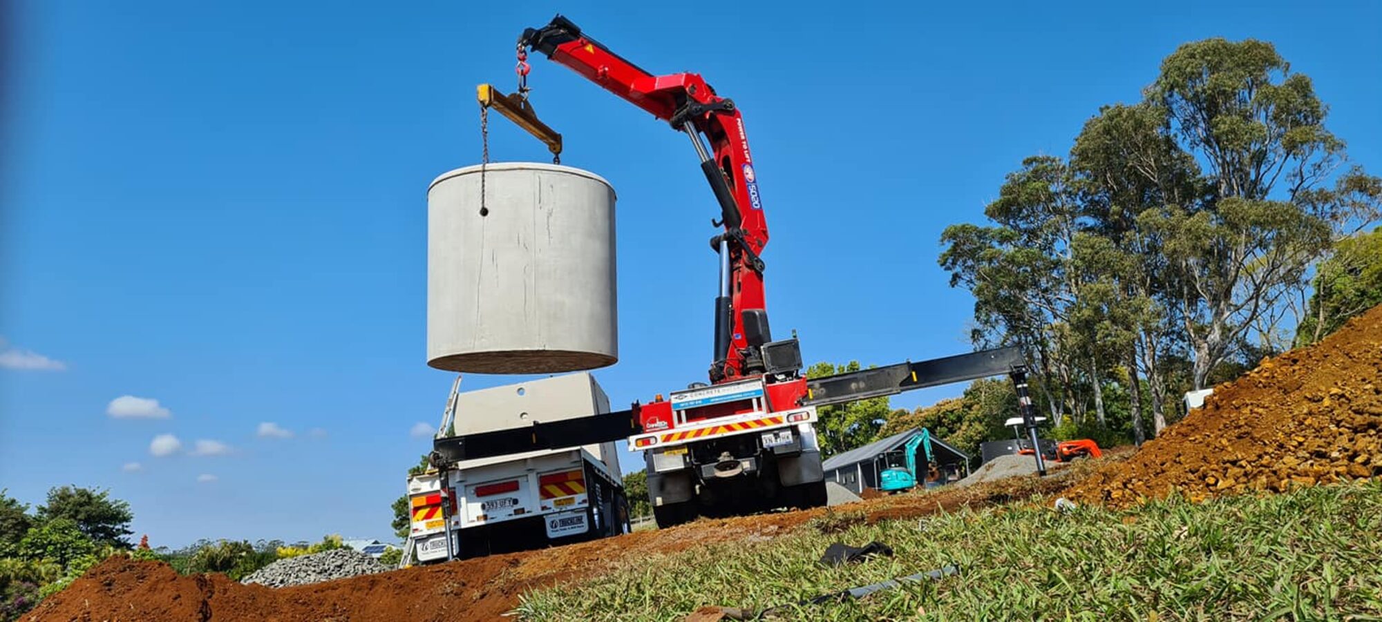 New septic tank craned into place on a Northern Rivers property